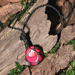 Rear view Coral necklace tied in black cord for stability and courage