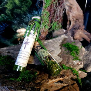 Strength Spell Jar displayed on moss and stone