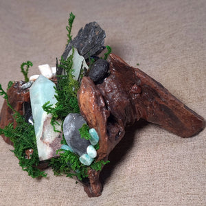 Witch-crafted driftwood base with Amazonite crystal and Black Kyanite blades.
