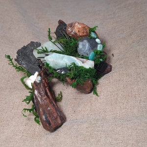 The Silent Shore – crystal forest sculpture with grounding stones and moss.