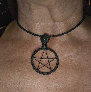 Black woven pentacle necklace shown worn as ritual jewellery and protective talisman