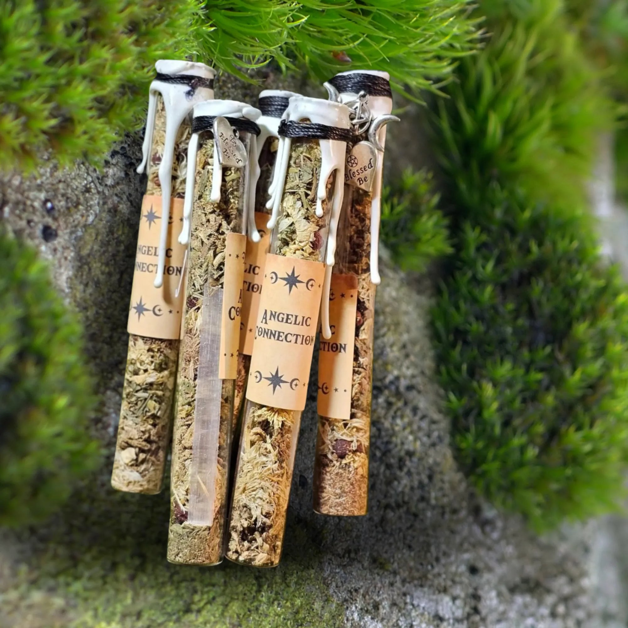 "Angelic Connection spell jar by Moss & Raven placed on moss and stone, crafted with herbs and crystals to support divine connection, lightwork, and angelic guidance."