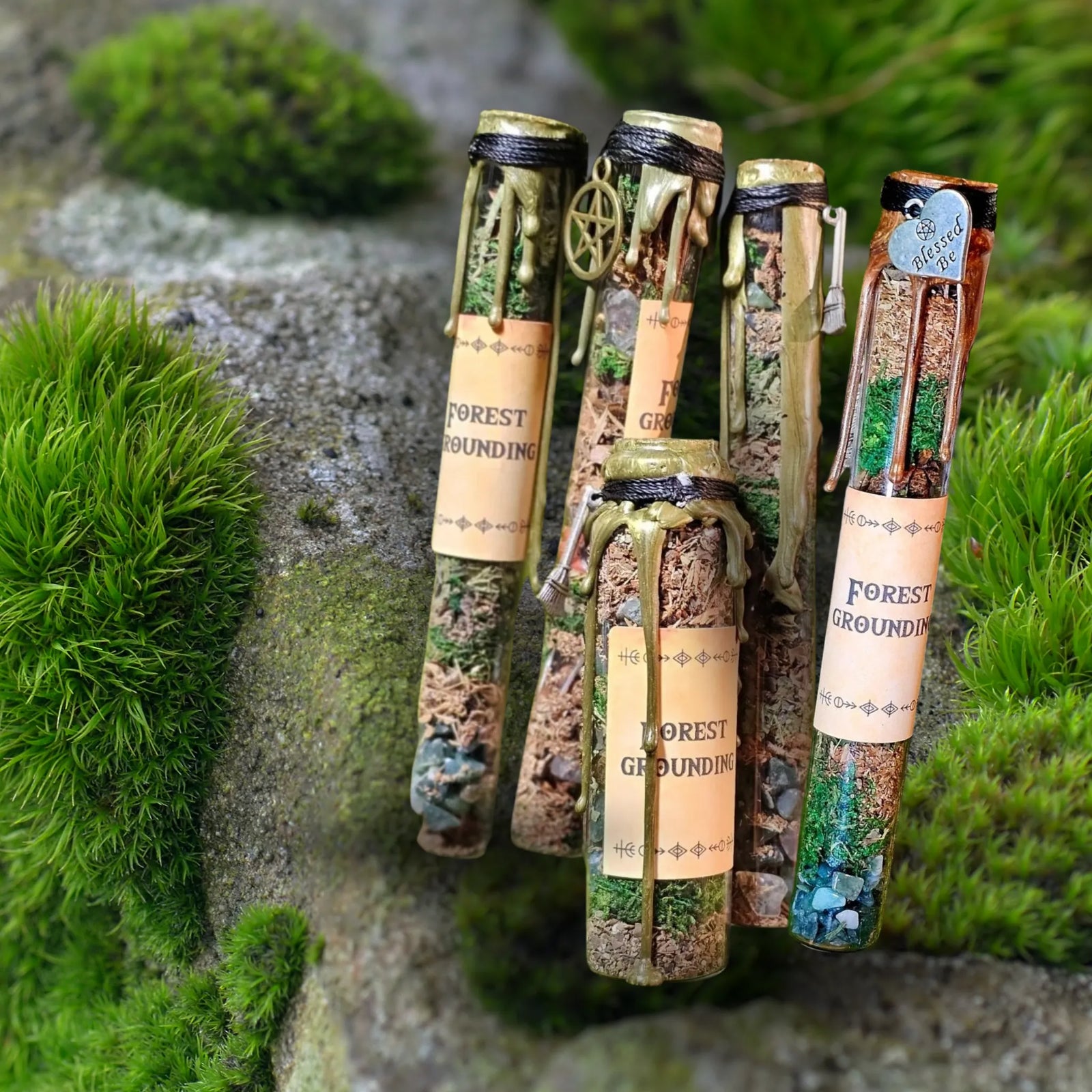 "Forest Grounding spell jar by Moss & Raven placed on moss and stone, crafted with herbs and crystals for grounding and connection to nature."