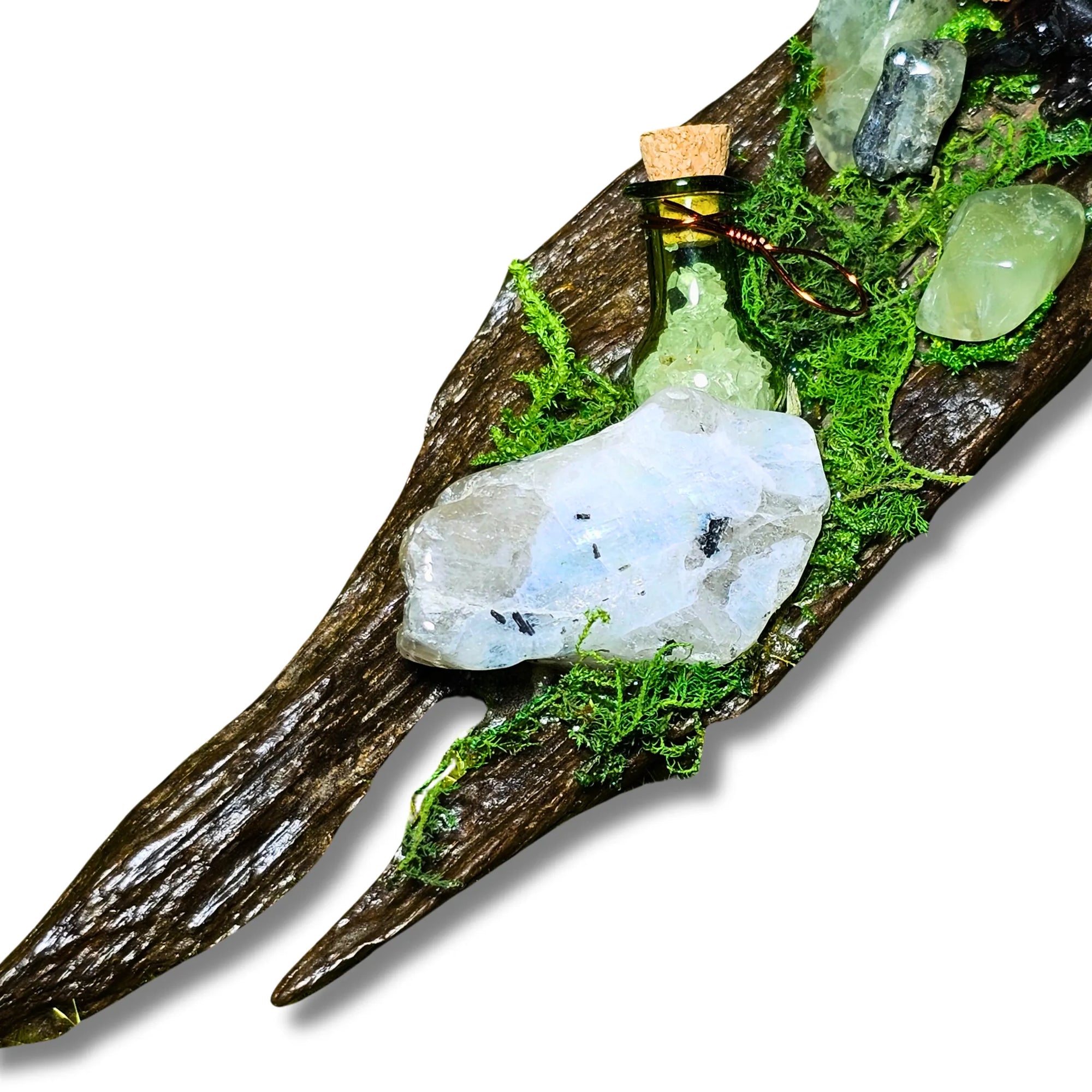 Nightborne crystal forest by Moss & Raven on white background. Features Clear Quartz, Moonstone, Prehnite, spell bottle, moss, acorn, pine cone, and driftwood.