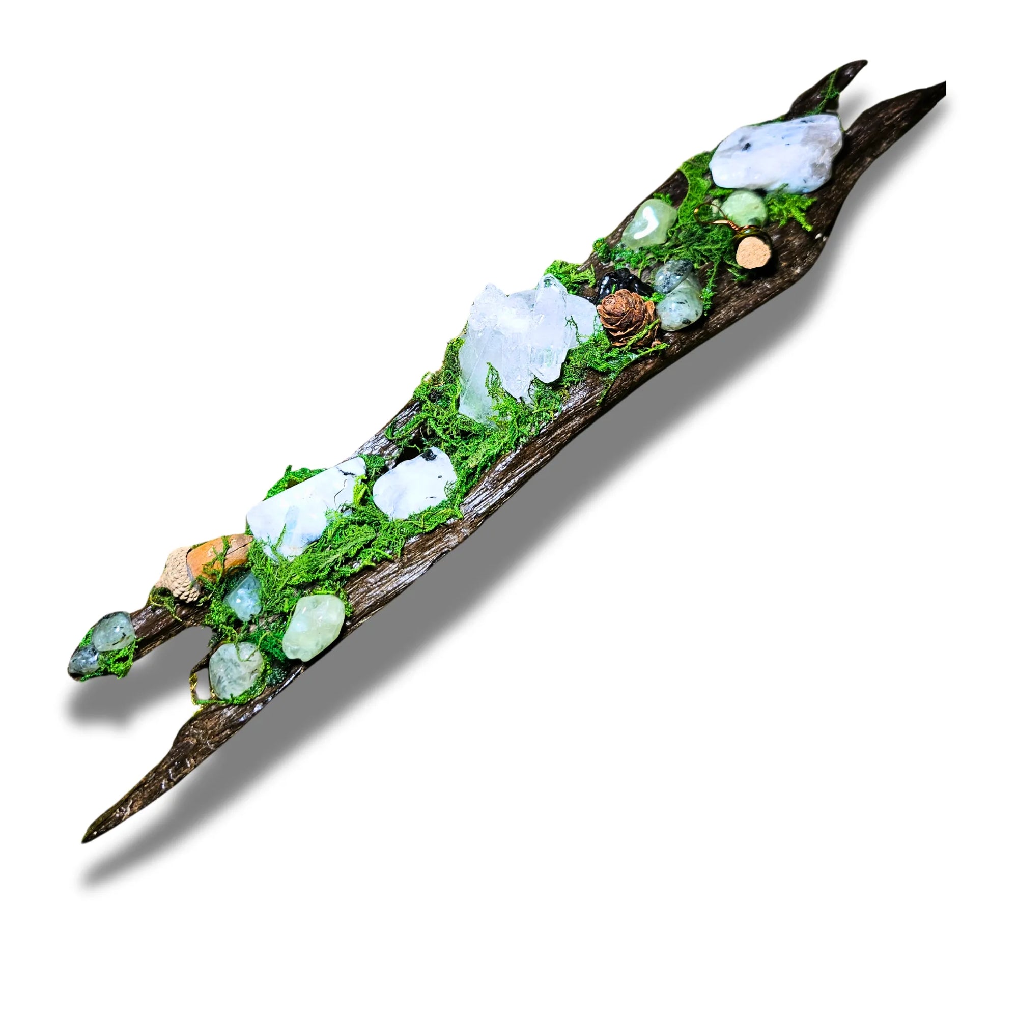 Nightborne crystal forest by Moss & Raven on white background. Features Clear Quartz, Moonstone, Prehnite, spell bottle, moss, acorn, pine cone, and driftwood.
