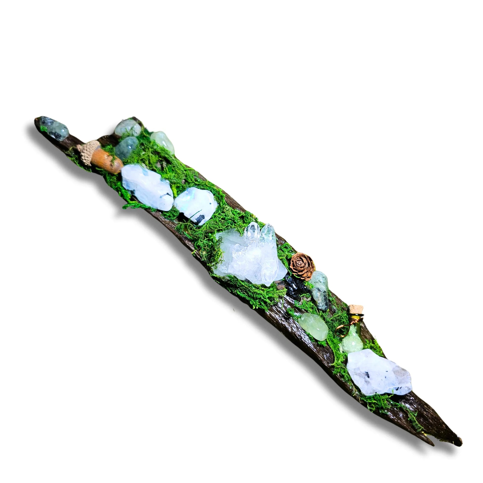 Nightborne crystal forest by Moss & Raven on white background. Features Clear Quartz, Moonstone, Prehnite, spell bottle, moss, acorn, pine cone, and driftwood.
