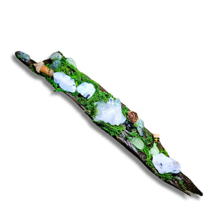 Nightborne crystal forest by Moss & Raven on white background. Features Clear Quartz, Moonstone, Prehnite, spell bottle, moss, acorn, pine cone, and driftwood.