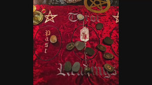 Witch’s Rune divination in motion with pendulum over casting cloth – spiritual reading setup in action