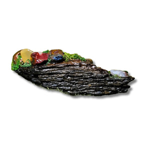 The Raven’s Nook miniature crystal forest by Moss & Raven on white background. Features Pietersite, Mookaite, moss, driftwood, and a sculpted raven head.