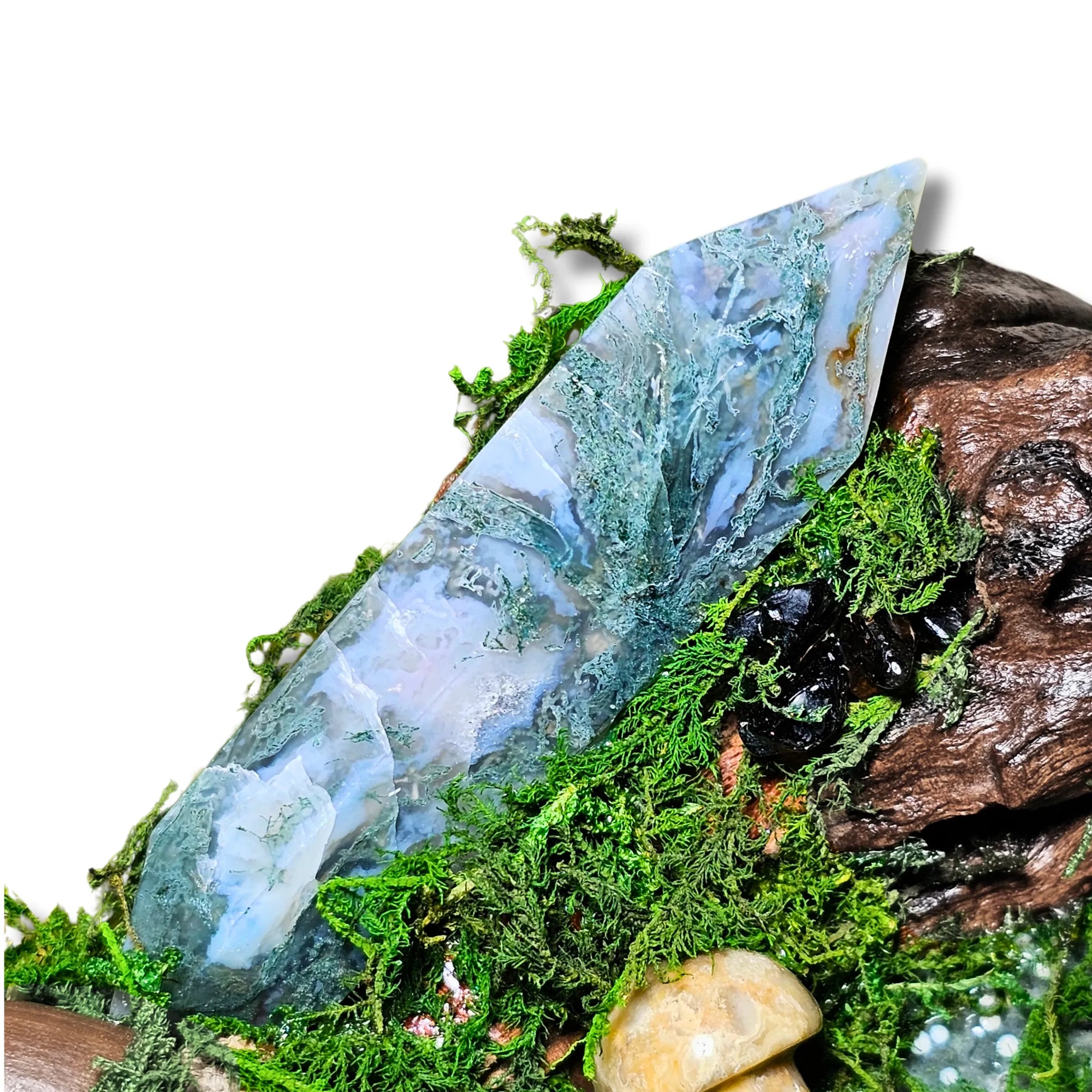 Wyrdwood crystal forest by Moss & Raven on white background. Features Moss Agate, Ocean Jasper, Smokey Quartz, Green Tourmaline, mushroom, moss, driftwood, acorn, and pine cone.